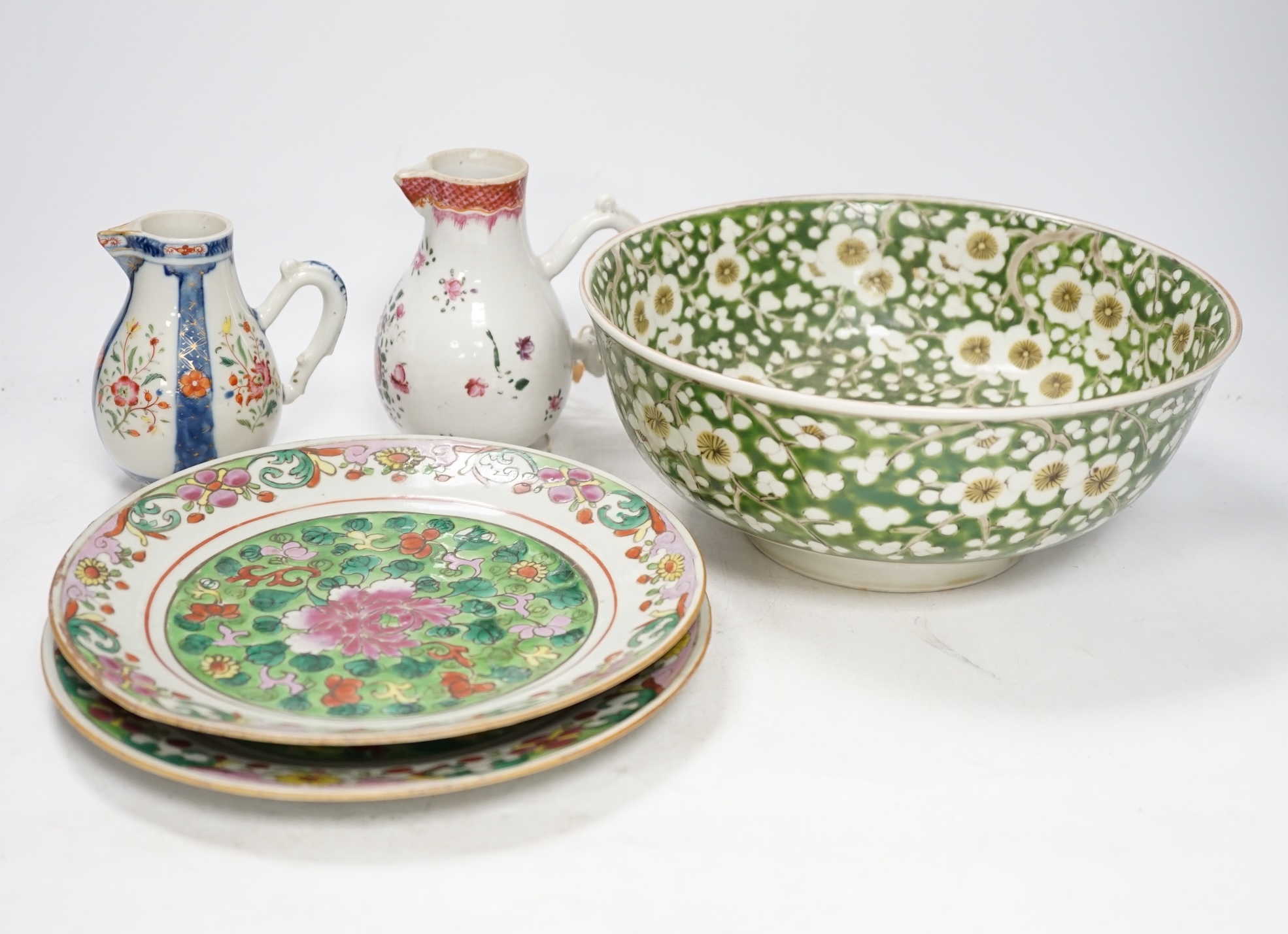 Two 18th century Chinese export porcelain jugs, a pair of famille rose plates made for the Thai market and a Japanese floral bowl, 24cm. Condition - varies